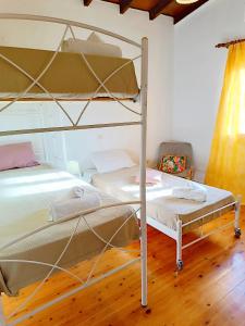 Postel nebo postele na pokoji v ubytování Elia House