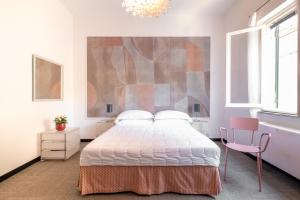 Rúm í herbergi á Albergo Minerva