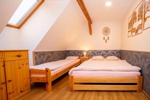 Postel nebo postele na pokoji v ubytování Apartmány Brychovi