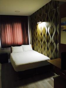 Postel nebo postele na pokoji v ubytování Okur Otel