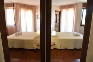 Postel nebo postele na pokoji v ubytování Hotel Sirio