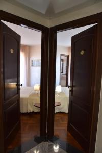 Postel nebo postele na pokoji v ubytování Hotel Sirio
