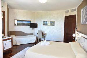 Postel nebo postele na pokoji v ubytování Hotel Sirio