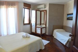 Postel nebo postele na pokoji v ubytování Hotel Sirio