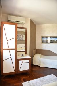 Postel nebo postele na pokoji v ubytování Hotel Sirio