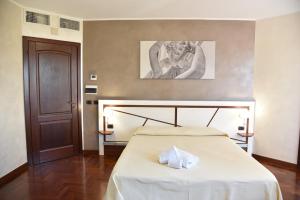 Postel nebo postele na pokoji v ubytování Hotel Sirio