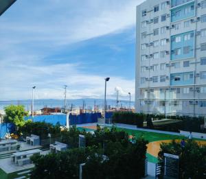 a view of a building from a balcony at Gallardo Homestay at Marina Spatial Condo in Dumaguete