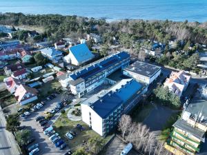 an aerial view of a city with the ocean at Akces Medical Fit & Spa in Dźwirzyno