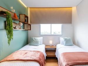 Ένα ή περισσότερα κρεβάτια σε δωμάτιο στο Apartametno inteiro perto da Arena MRV e expominas