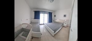 Ένα ή περισσότερα κρεβάτια σε δωμάτιο στο Dream Apartment