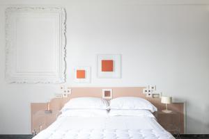 Rúm í herbergi á Albergo Minerva