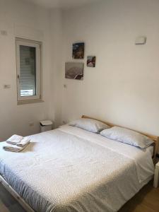 Postel nebo postele na pokoji v ubytování La Dimora di Piccianello 16B