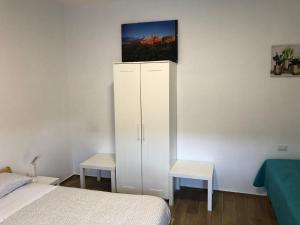 Postel nebo postele na pokoji v ubytování La Dimora di Piccianello 16B