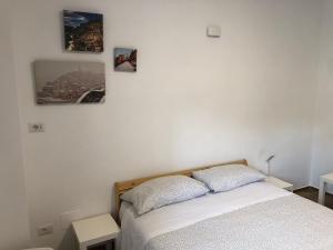 Postel nebo postele na pokoji v ubytování La Dimora di Piccianello 16B