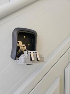 a door latch with a key on a drawer at Inspire Home Stylish Stay B in Cardiff