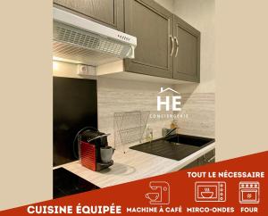 a picture of a kitchen with a stove top oven at Room New York Proche Gare 400m in Montargis