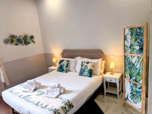 a bedroom with a bed with towels on it at DM69 - Termini Monti Crossroads in Rome