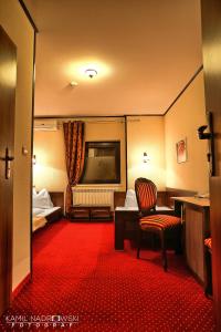 Postel nebo postele na pokoji v ubytování Hotel Zodiak