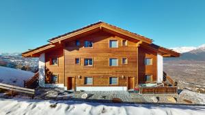 a log cabin in the snow on a mountain at Perce Neige SUBLIME & VIEW apartments by Alpvision Résidences in Veysonnaz