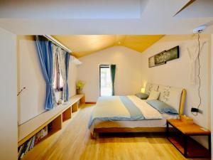 Postel nebo postele na pokoji v ubytování Jianshui Fanqi Boutique B&B