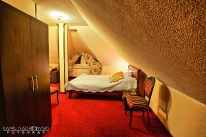 Postel nebo postele na pokoji v ubytování Hotel Zodiak