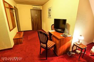 TV a/nebo společenská místnost v ubytování Hotel Zodiak