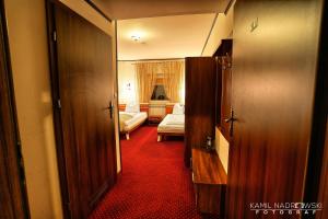 Postel nebo postele na pokoji v ubytování Hotel Zodiak