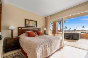 a bedroom with a bed and a view of the ocean at Penthouse with Jacuzzi by Costarentals - Ref 244 in Fuengirola