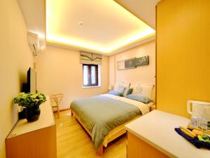 Postel nebo postele na pokoji v ubytování Jianshui Fanqi Boutique B&B