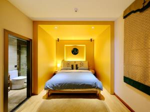 Postel nebo postele na pokoji v ubytování Jianshui Fanqi Boutique B&B