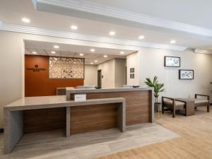 a lobby of a hospital with a reception desk at Candlewood Suites Arundel Mills / BWI Airport by IHG in Hanover