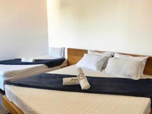 Postel nebo postele na pokoji v ubytování Kim Minh Apartment & Hotel