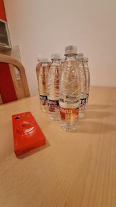 a group of bottles of water sitting on a table at Apartment Seka in Podčetrtek