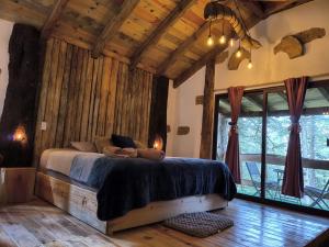 Postel nebo postele na pokoji v ubytování cedro + 2 fotografie