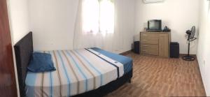 Ліжко або ліжка в номері Casa mono ambiente y piscina.