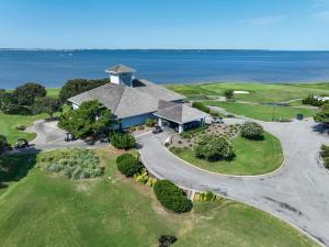 an aerial view of a house with the ocean in the background at Waterfront luxury w-beach resort-pool-golf-tennis-fishing & views! in Nags Head
