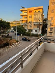 a car driving on a city street with buildings at Batroun Loft Guest House in Batroûn