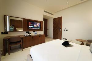 TV a/nebo společenská místnost v ubytování Hotel Millennium + 32 fotografií
