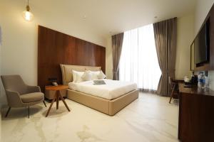 Postel nebo postele na pokoji v ubytování Hotel Millennium