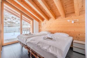 Postel nebo postele na pokoji v ubytování Ski Paradise MOUNTAIN & LUXE apartments