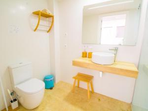 a bathroom with a toilet and a sink at ViIla Savina By North Properties Mallorca in Can Picafort