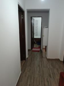 an empty room with a hallway with a hard wood floor at Casa Iriss in Calafat