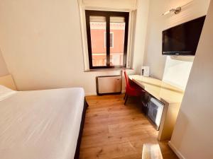 TV a/nebo společenská místnost v ubytování Hotel Pex Mantova
