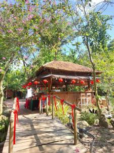 a pavilion with red ribbons in front of it at LUX HOME Phước Hải in Hội Mỹ