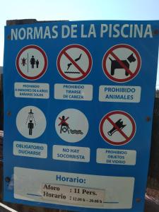 a sign on the side of a road with prohibited signs at Cottage in Alcuéscar