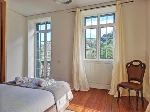 Ένα ή περισσότερα κρεβάτια σε δωμάτιο στο Quinta Do Serrado 2