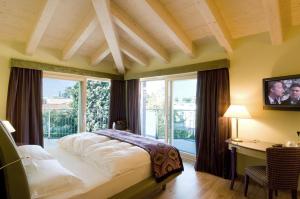 Posteľ alebo postele v izbe v ubytovaní Parc Hotel Flora S