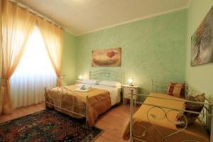 Postel nebo postele na pokoji v ubytování B&B La Villa