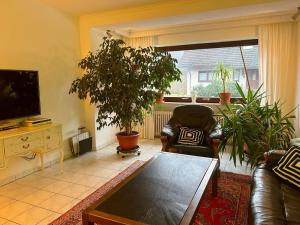 a living room with a couch and a table at Ferienhaus La Meu in Trassem