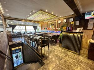 a dining room with tables and chairs in a restaurant at Maranda Suit Hotel in Istanbul
